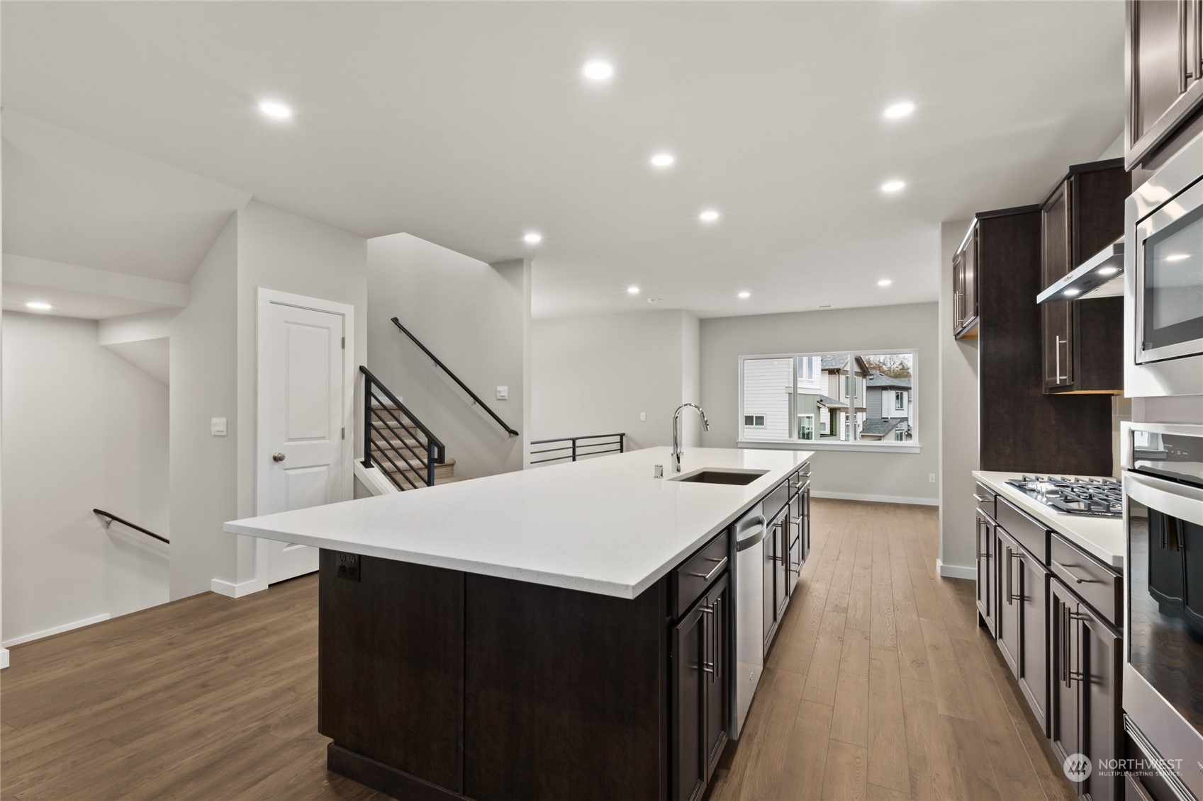 327 207th Street Southeast Bothell, WA 98012 - Photo 17 of 31 a kitchen with a sink and wooden floor