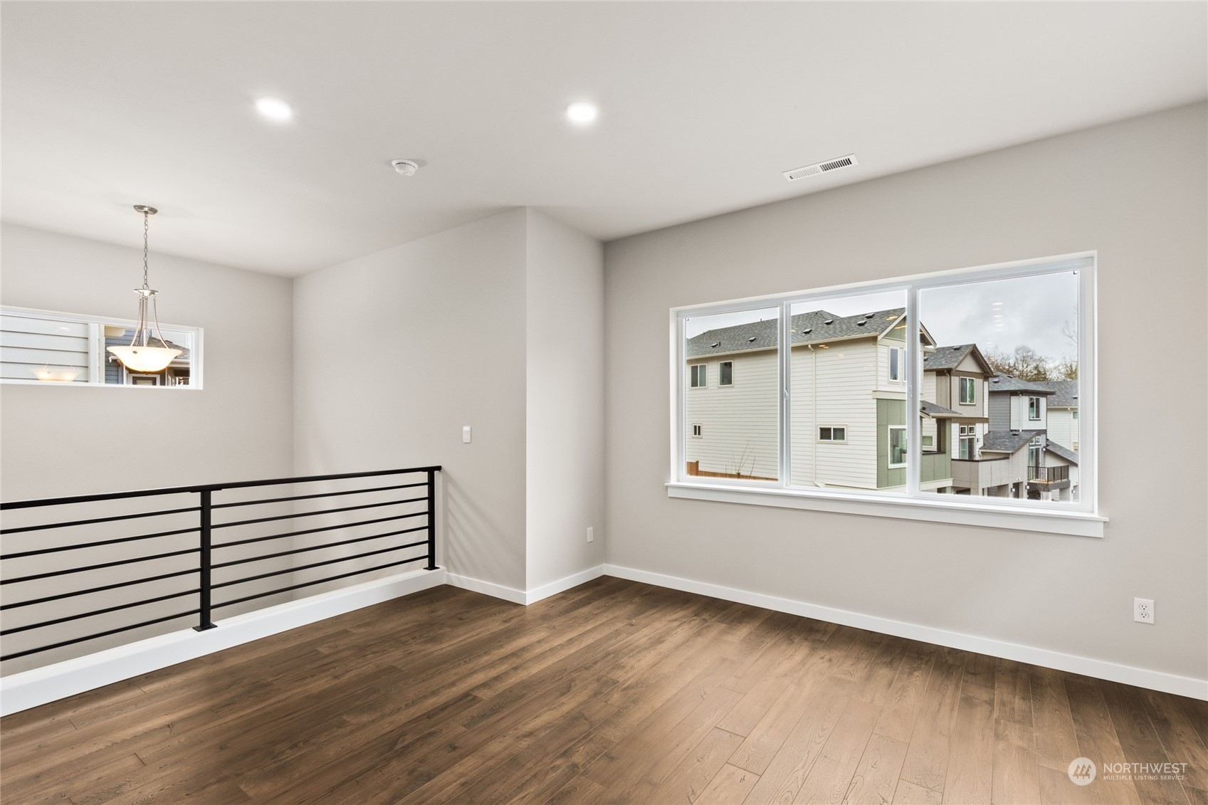 327 207th Street Southeast Bothell, WA 98012 - Photo 20 of 31 a view of a livingroom with wooden floor and a window
