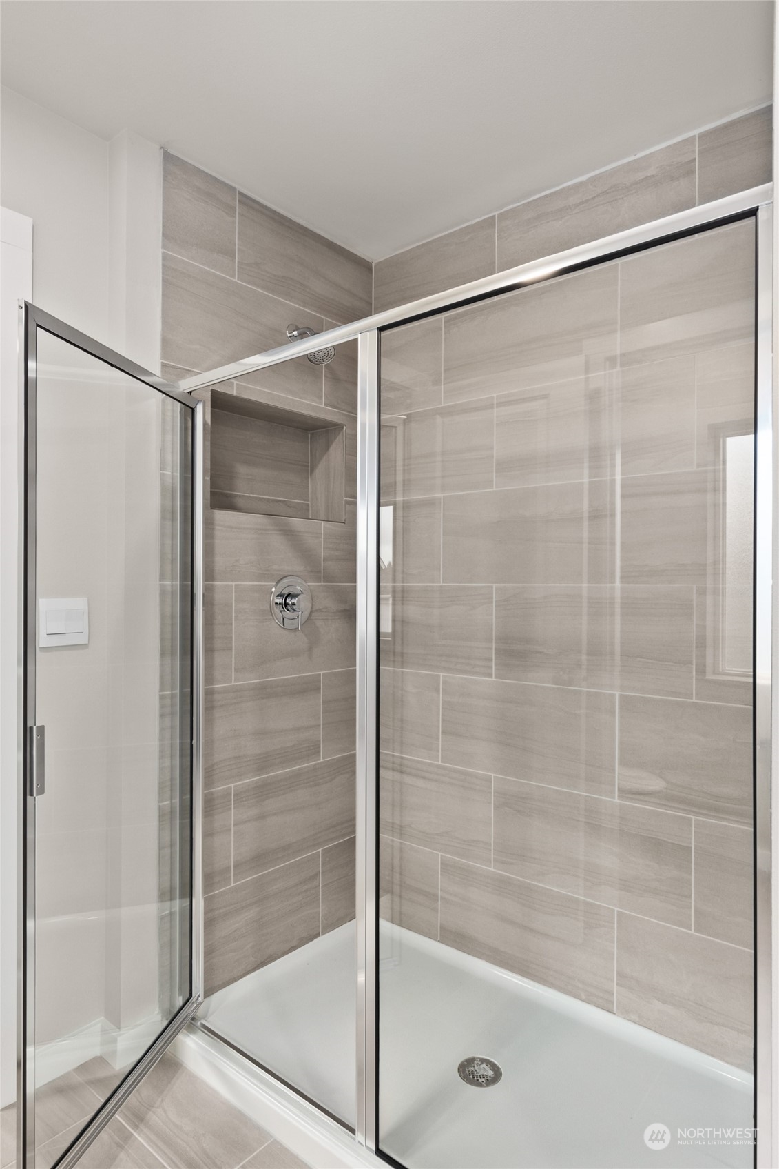 327 207th Street Southeast Bothell, WA 98012 - Photo 23 of 31 a bathroom with a glass shower door