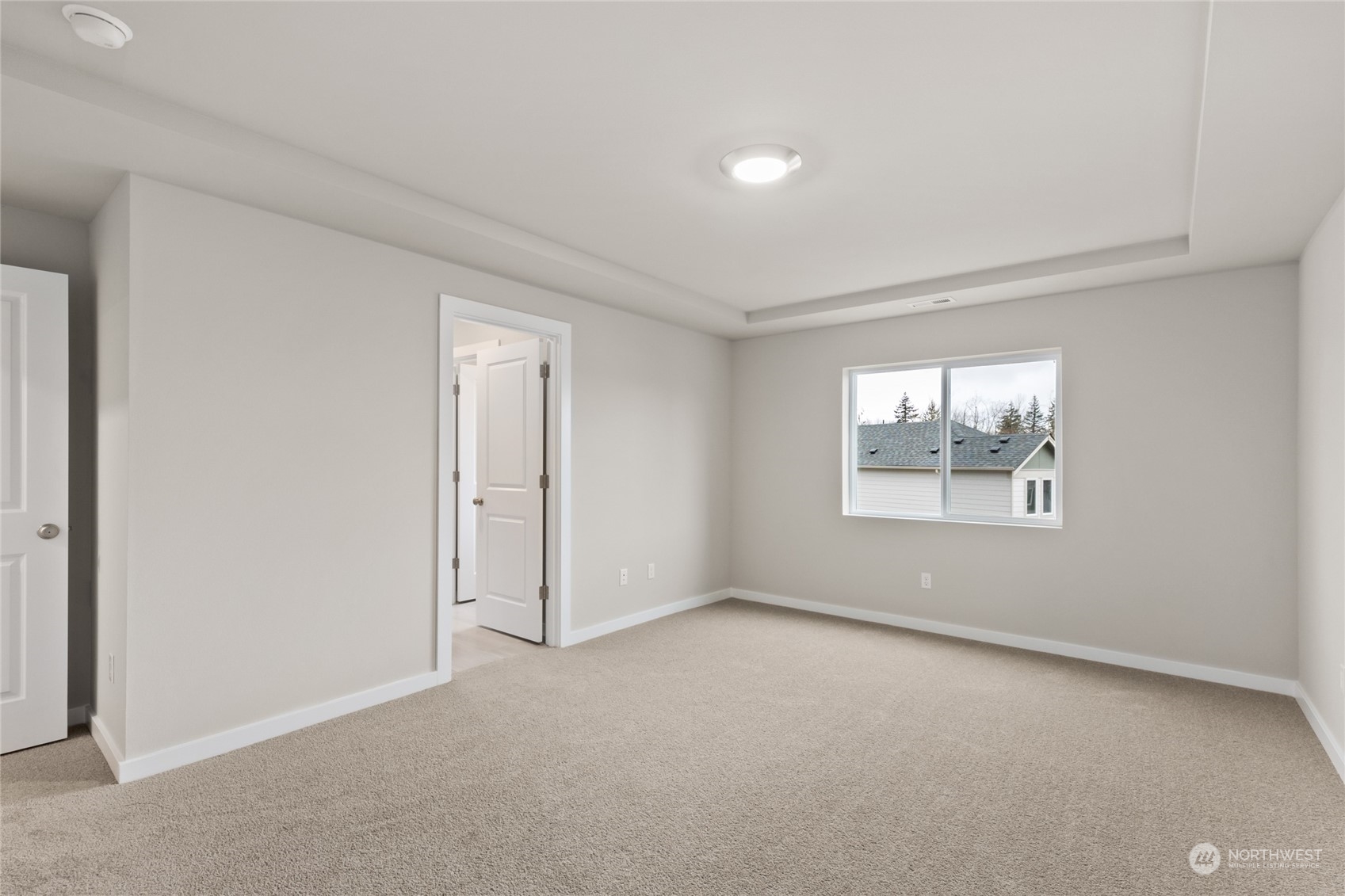 327 207th Street Southeast Bothell, WA 98012 - Photo 4 of 31 an empty room with windows