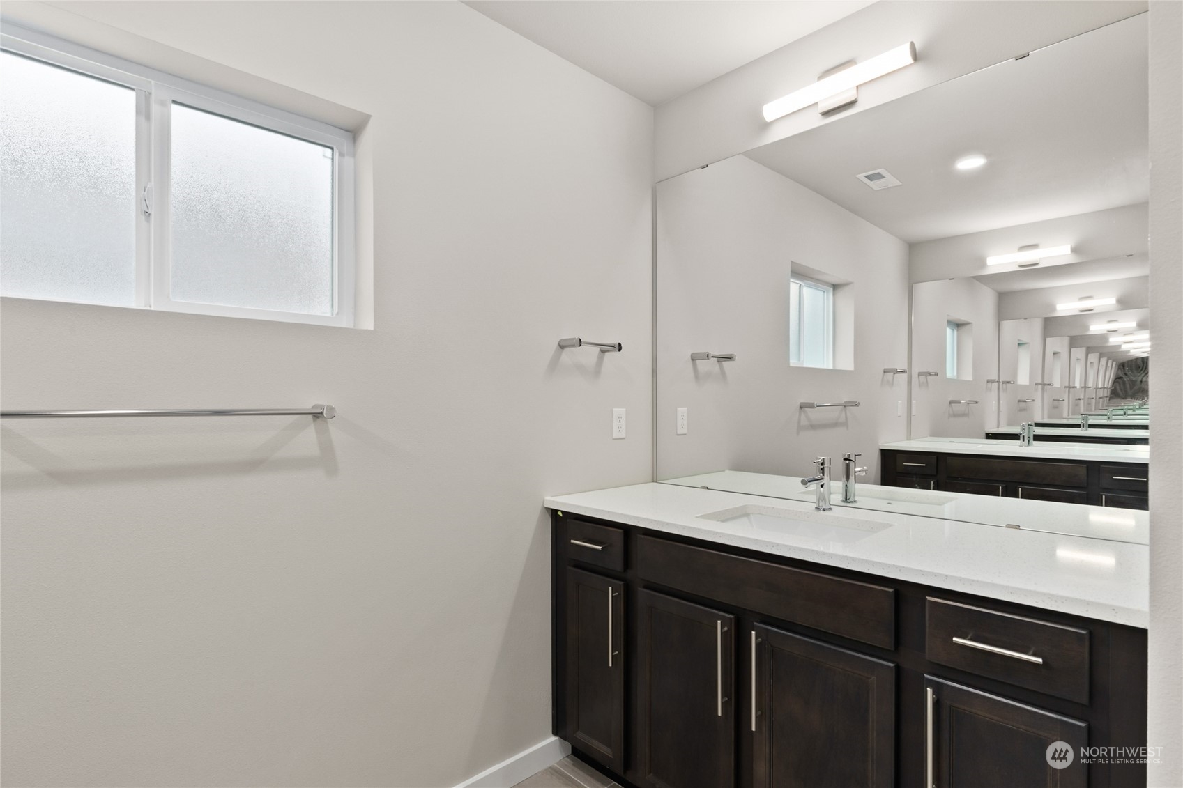 327 207th Street Southeast Bothell, WA 98012 - Photo 5 of 31 a bathroom with a double vanity sink and mirror