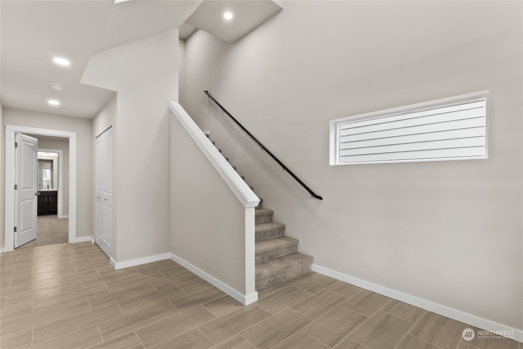 327 207th Street Southeast Bothell, WA 98012 - Photo 6 of 31 wooden floor in an empty room with a window