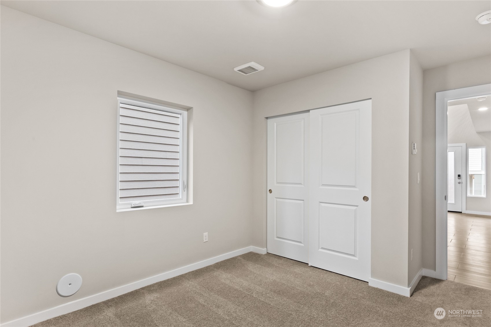 327 207th Street Southeast Bothell, WA 98012 - Photo 8 of 31 an empty room with windows