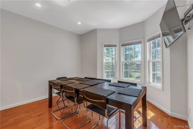 a view of a dining room with furniture window and outside view