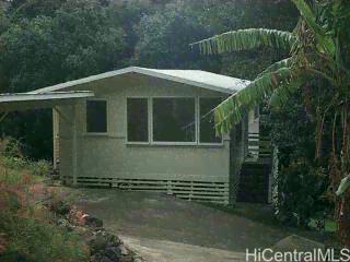 2863 Numana Road, Unit 2863 Honolulu, HI 96819 - Photo 1 of 1 a front view of a house with a yard