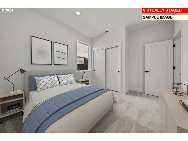 a bedroom with a bed and a cabinets