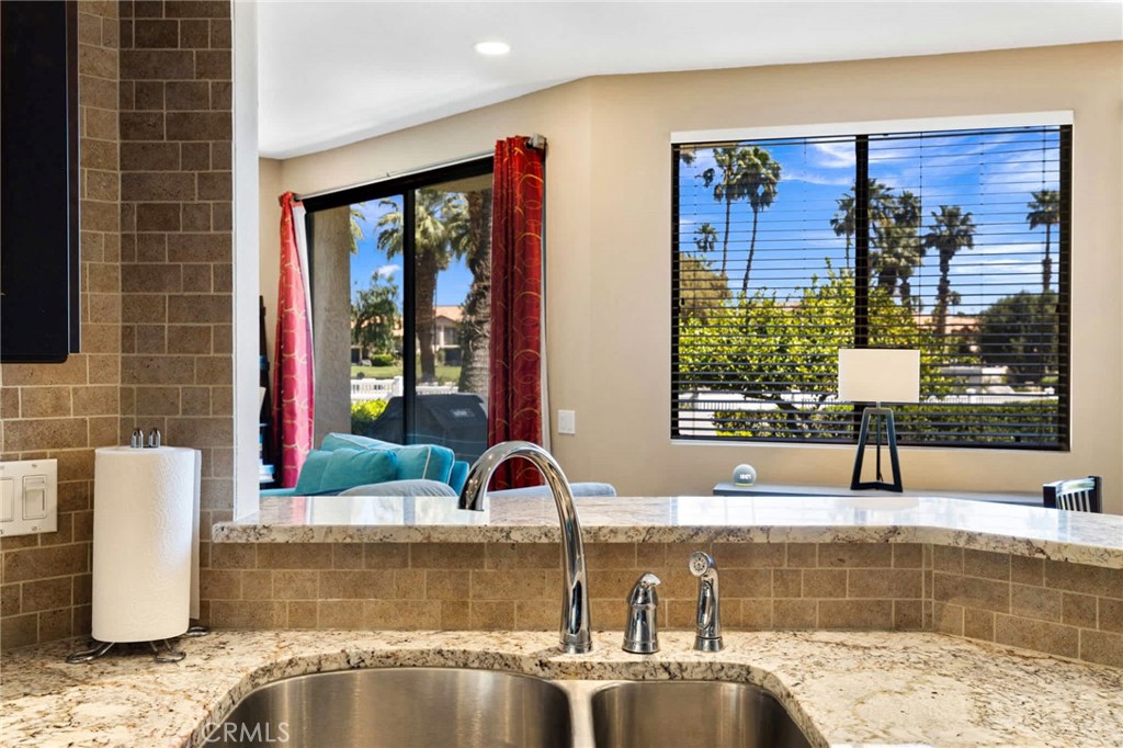 55108 Firestone La Quinta, CA 92253 - Photo 12 of 47 a view of a kitchen with a sink and a window