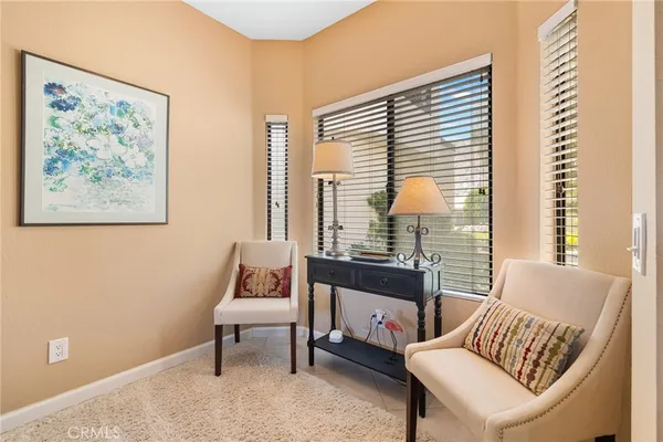 a kitchen with stainless steel appliances kitchen island granite countertop a refrigerator and a stove top oven