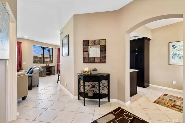 a spacious bedroom with a bed and a dresser