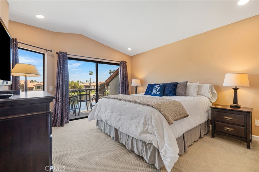55108 Firestone La Quinta, CA 92253 - Photo 17 of 47 a spacious bedroom with a bed and a dresser