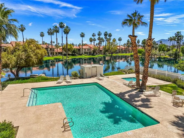 a view of a water fountain and a big yard