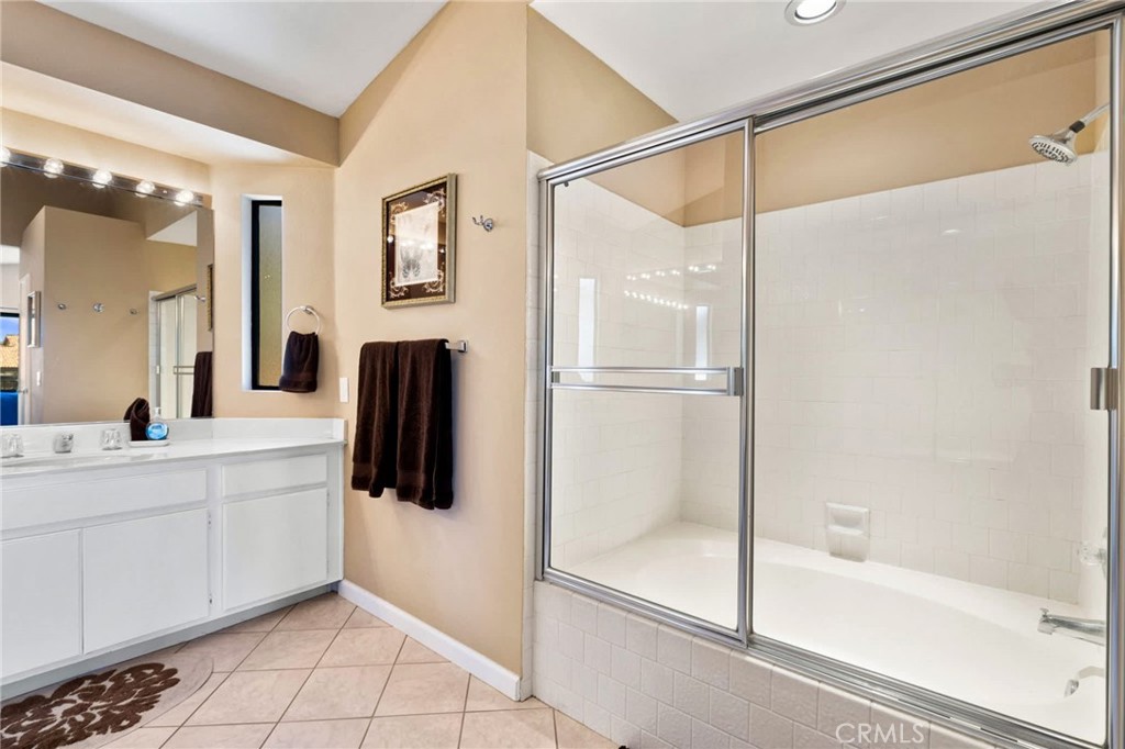 55108 Firestone La Quinta, CA 92253 - Photo 21 of 47 a bathroom with a bathtub and a shower