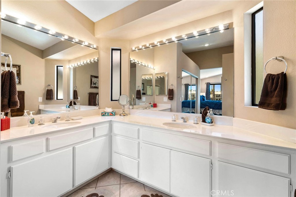 55108 Firestone La Quinta, CA 92253 - Photo 22 of 47 a bathroom with a sink and a mirror