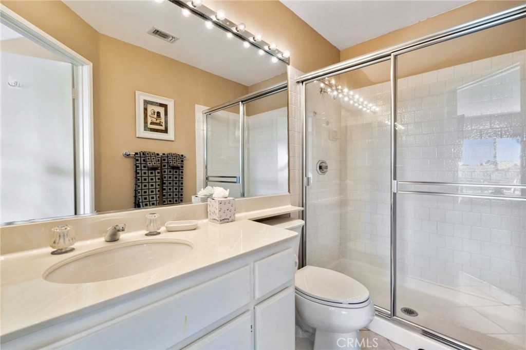 55108 Firestone La Quinta, CA 92253 - Photo 25 of 47 a bathroom with a sink toilet and shower