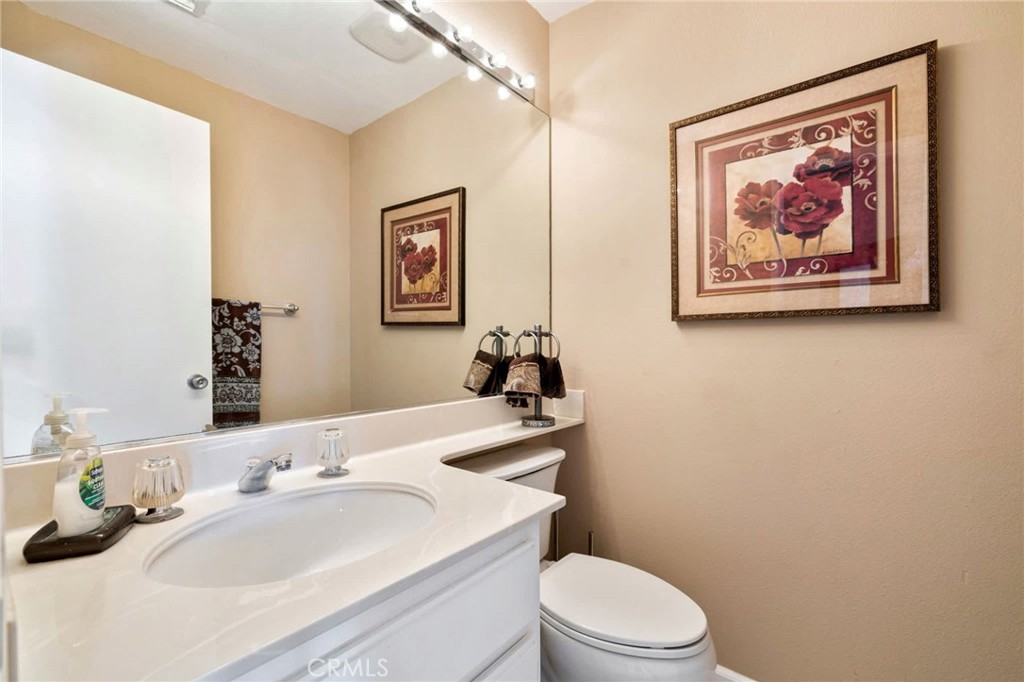 55108 Firestone La Quinta, CA 92253 - Photo 26 of 47 a bathroom with a sink mirror and toilet
