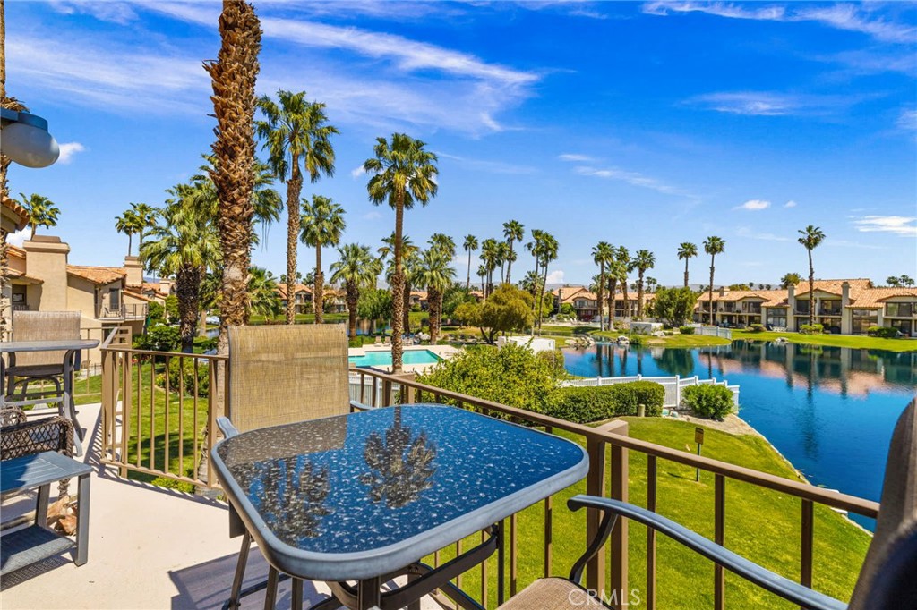 55108 Firestone La Quinta, CA 92253 - Photo 27 of 47 a view of a swimming pool with outdoor seating