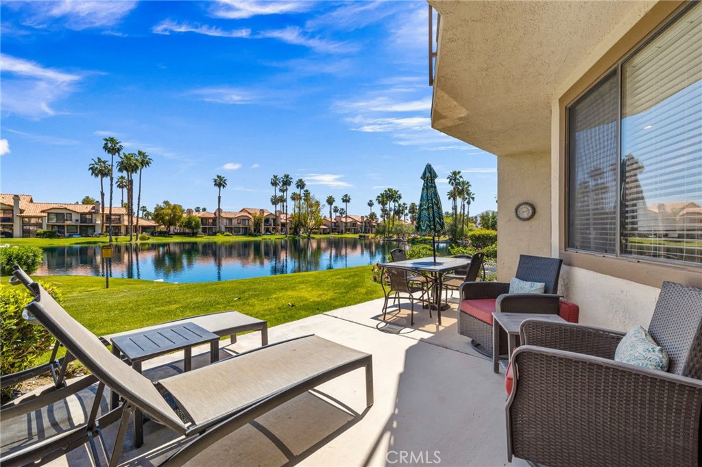 55108 Firestone La Quinta, CA 92253 - Photo 28 of 47 a view of a patio with swimming pool and outdoor seating