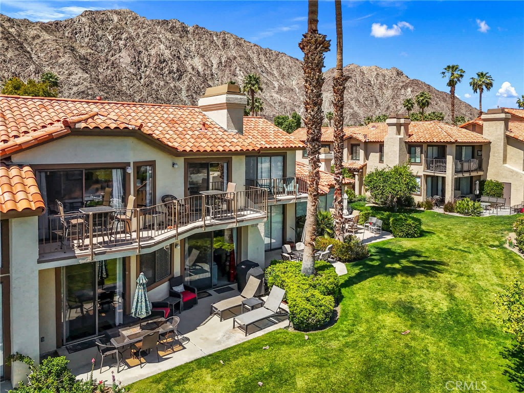 55108 Firestone La Quinta, CA 92253 - Photo 30 of 47 a front view of a building with swimming pool