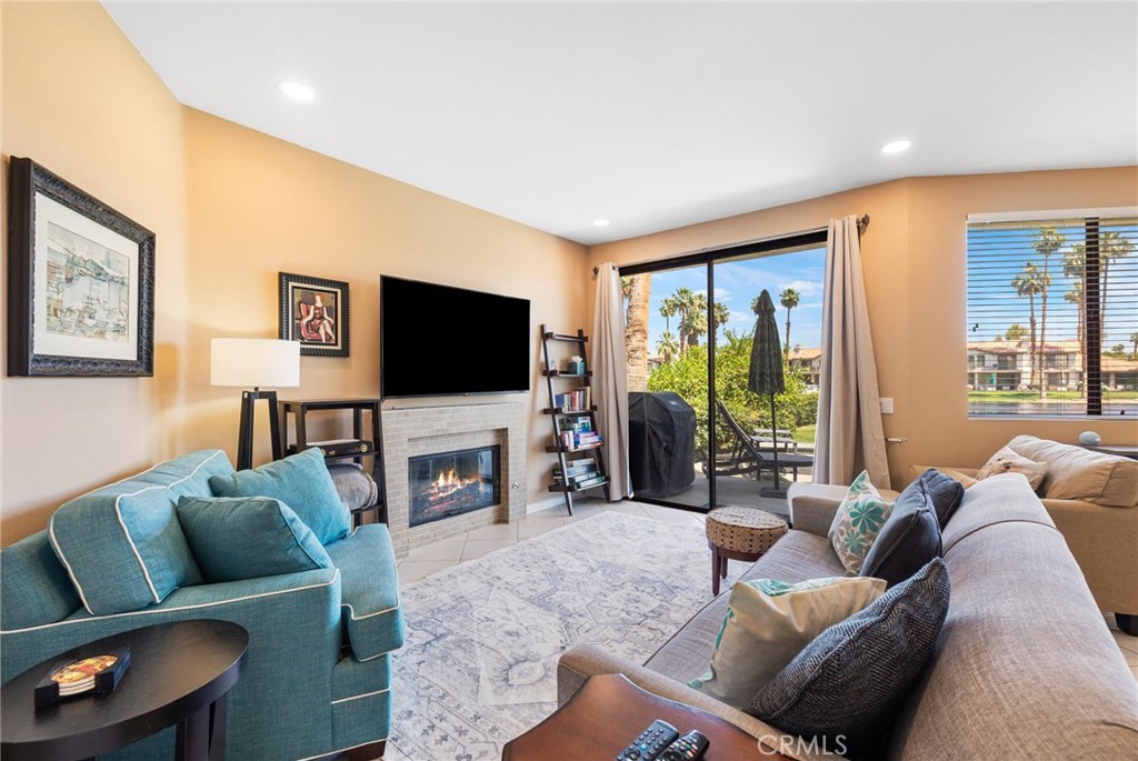 55108 Firestone La Quinta, CA 92253 - Photo 3 of 47 a living room with furniture and a flat screen tv