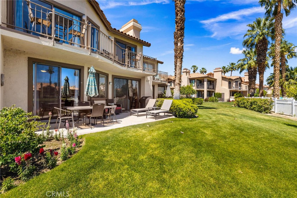 55108 Firestone La Quinta, CA 92253 - Photo 31 of 47 a view of a house with swimming pool and sitting area