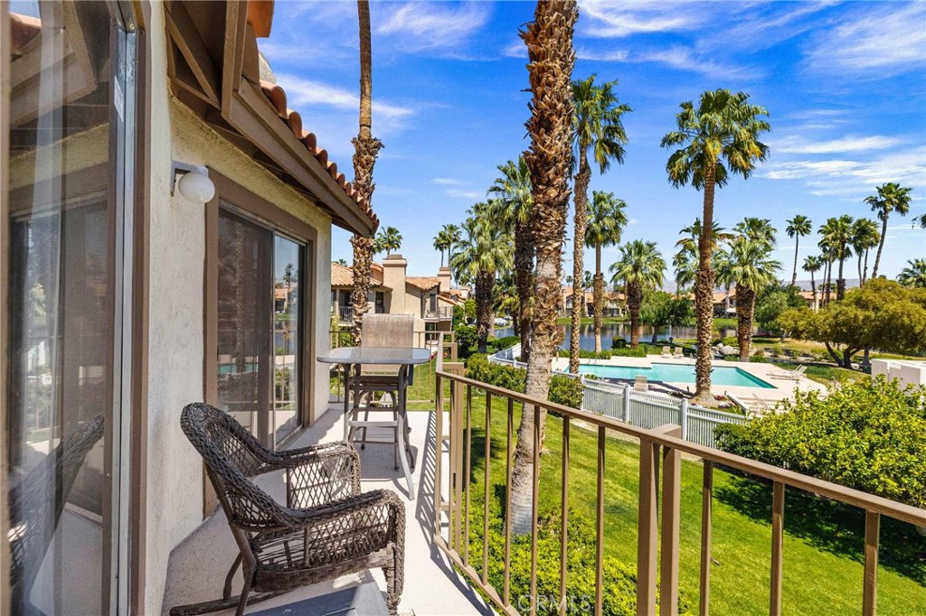 55108 Firestone La Quinta, CA 92253 - Photo 34 of 47 a view of a chair and tables in the balcony