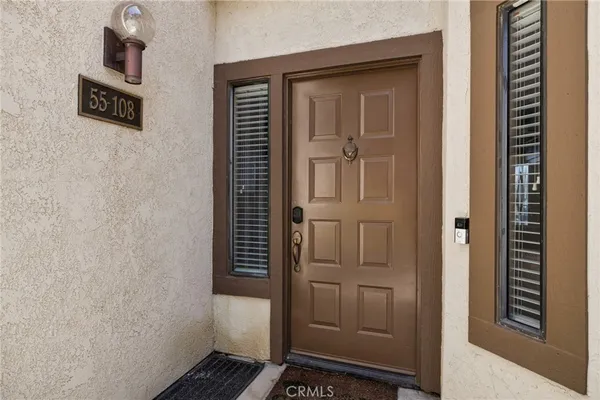 a view of a building with sitting area