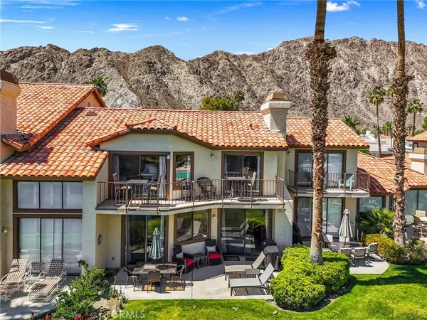 an aerial view of a house with a ocean view