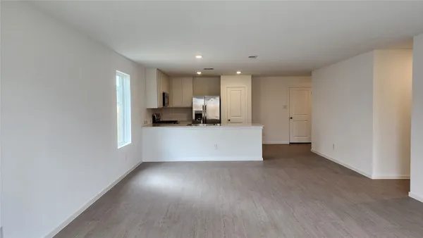 a kitchen with kitchen island a sink stainless steel appliances and cabinets