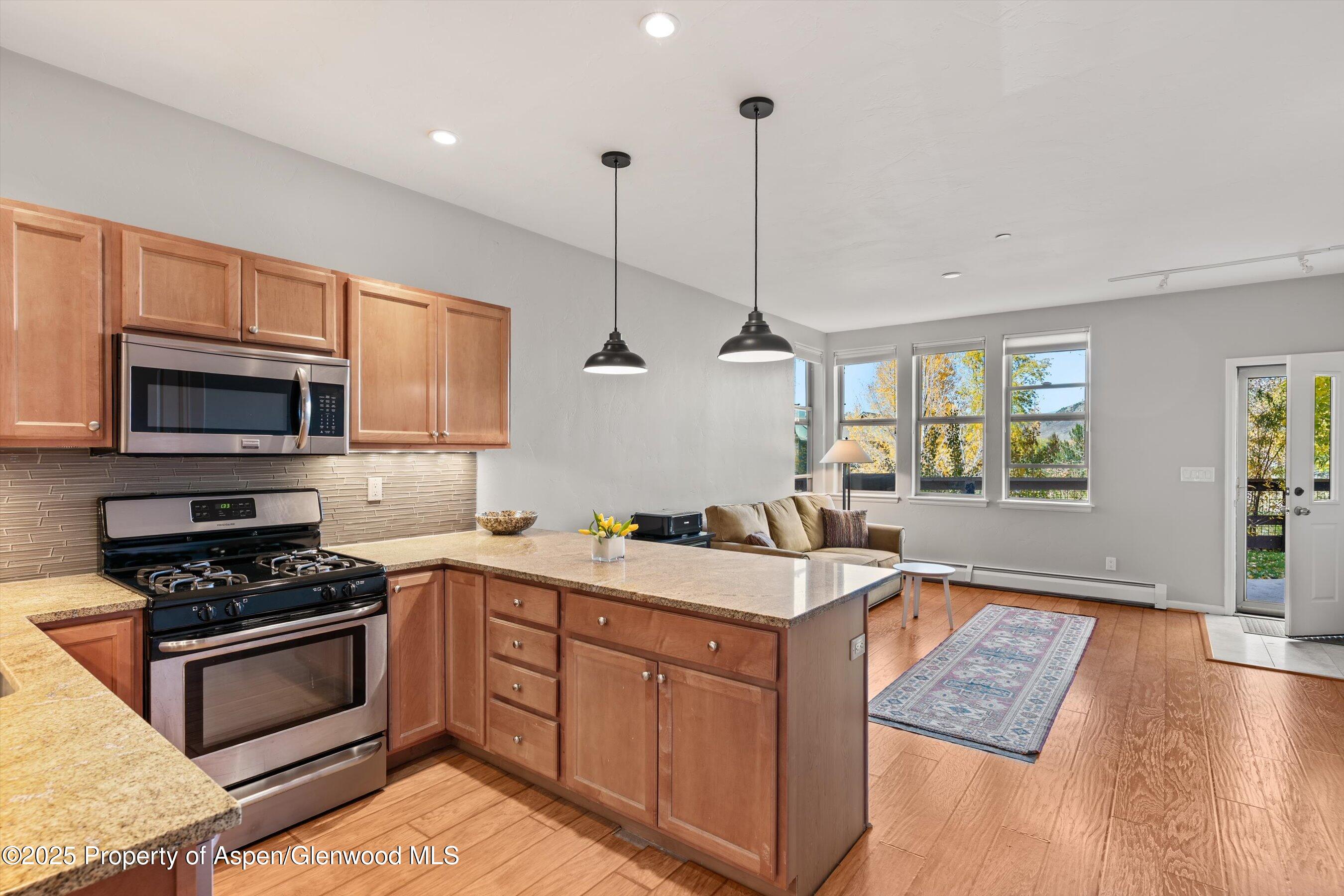 1330 East Valley Road Basalt, CO 81621 - Photo 12 of 18 a kitchen with a sink stove and microwave