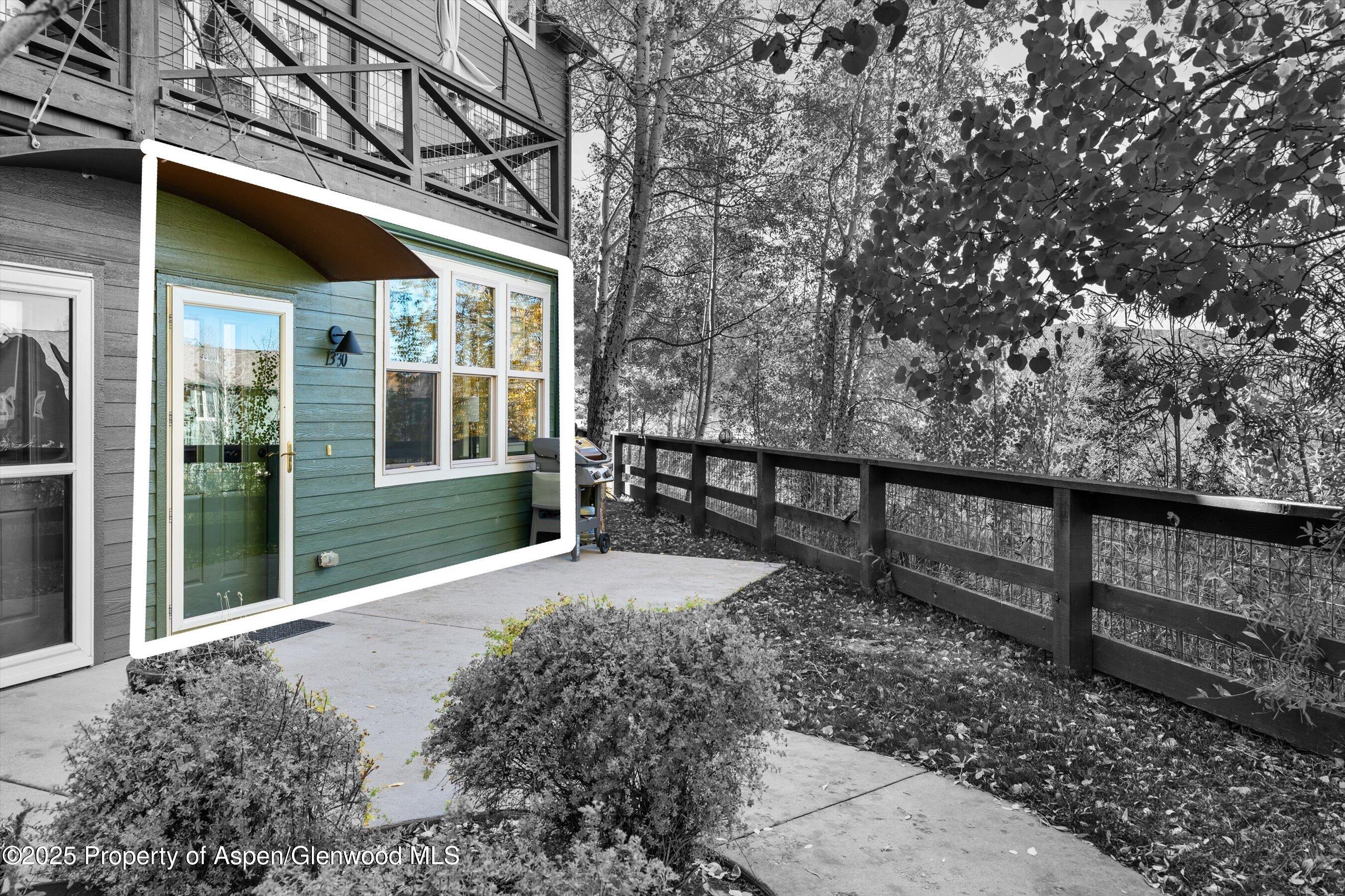 1330 East Valley Road Basalt, CO 81621 - Photo 5 of 18 a view of a house with a large tree and wooden fence
