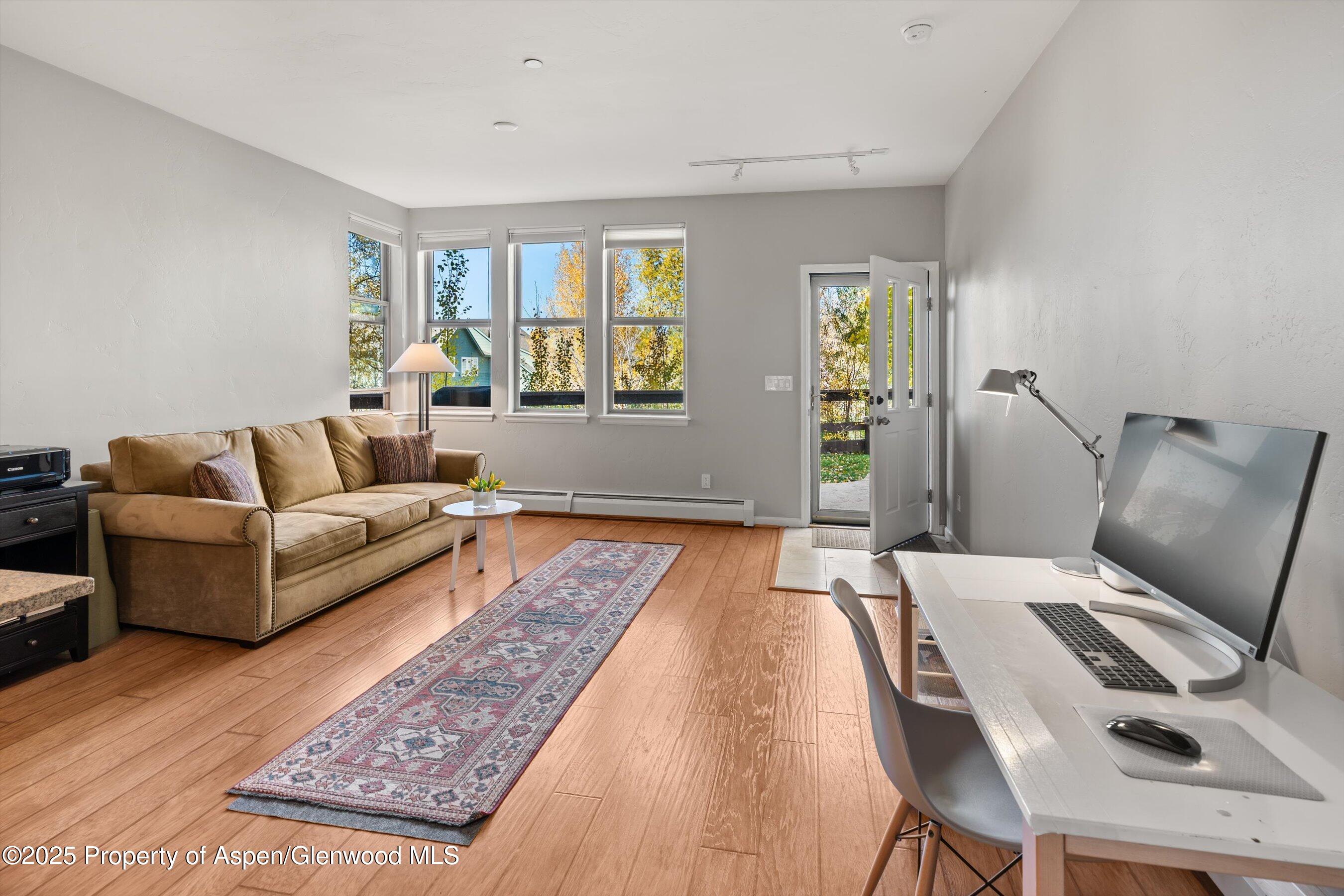 1330 East Valley Road Basalt, CO 81621 - Photo 7 of 18 a living room with furniture and wooden floor