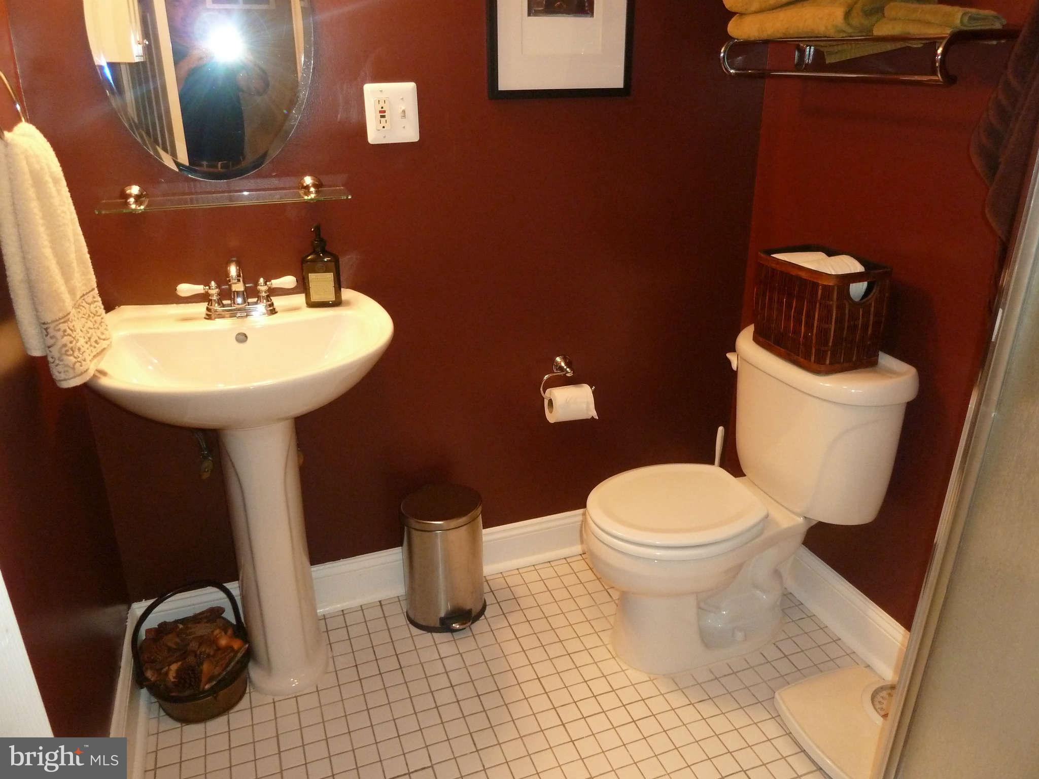 2002 Dayton Street Silver Spring, MD 20902 - Photo 14 of 20 a bathroom with a sink toilet and mirror