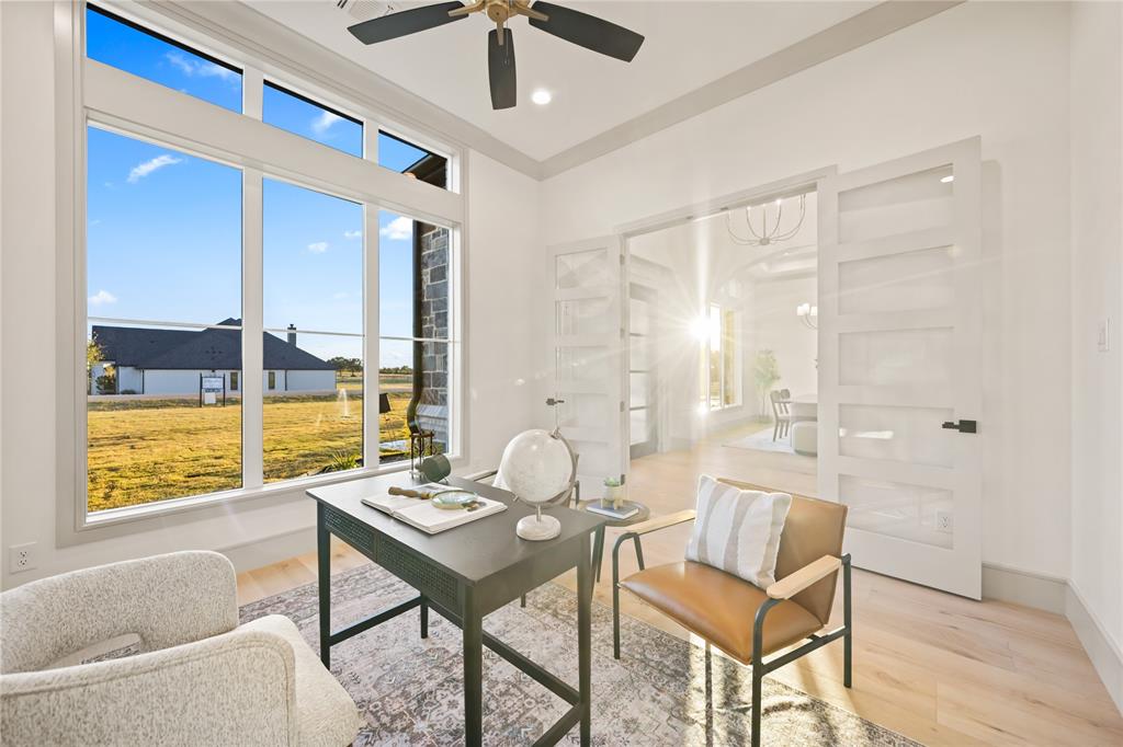 724 Cooper Trail Weatherford, TX 76087 - Photo 12 of 37 Dedicated room with expansive multi-pane windows, light wood-finish flooring, and a ceiling fan