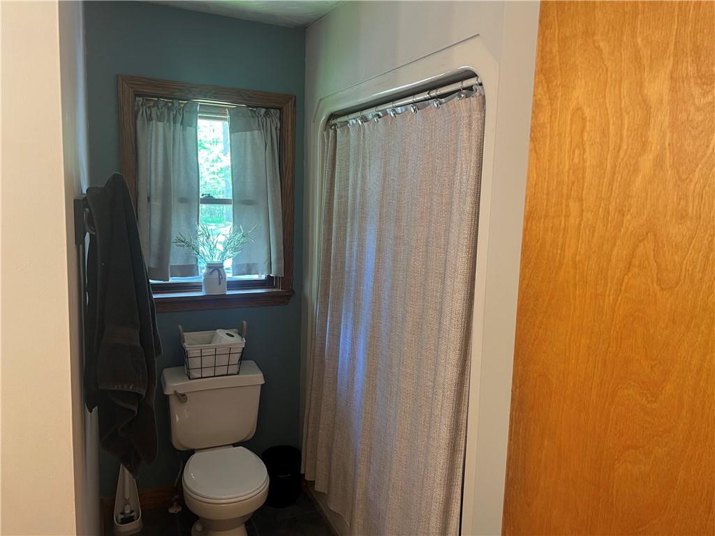 121 Pitts Road Jamestown, PA 16134 - Photo 16 of 28 a bathroom with a toilet a sink and shower