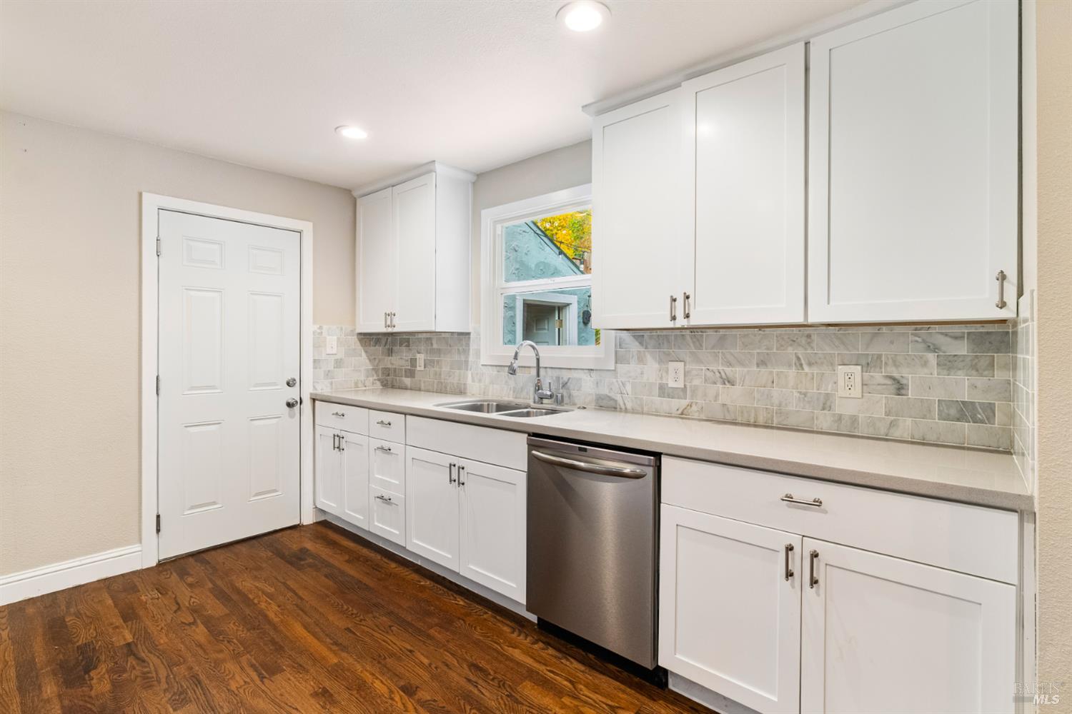 2136 Franklin Avenue Santa Rosa, CA 95404 - Photo 9 of 22 a kitchen with a sink cabinets and wooden floor