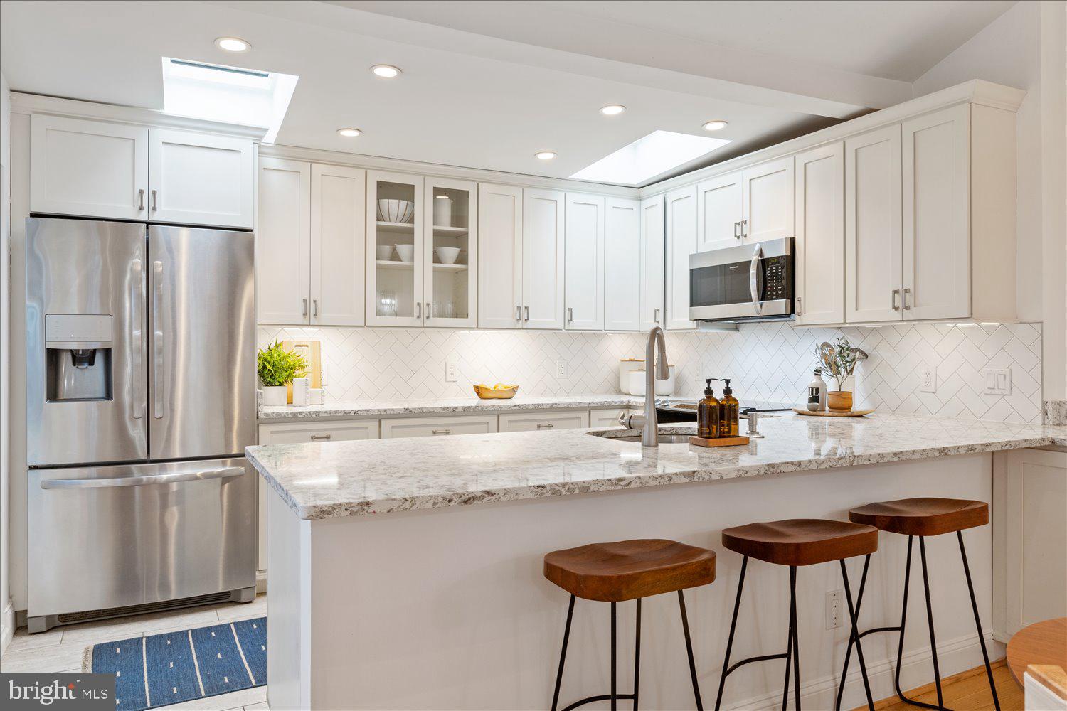 203 9th Street Southeast Washington, DC 20003 - Photo 11 of 50 Open kitchen with breakfast bar