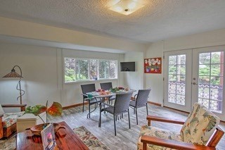 19-3940 Hoonanea Street Volcano, HI 96785 - Photo 13 of 30 a view of a dining room with furniture window and wooden floor