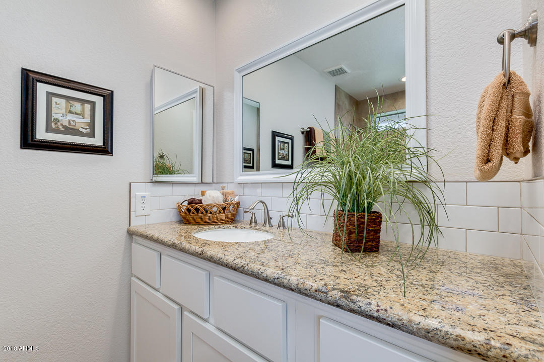 6320 Casper Road Mesa, AZ 85205 - Photo 19 of 35 a bathroom with sink and mirror