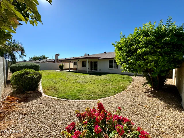 a view of a backyard with a garden