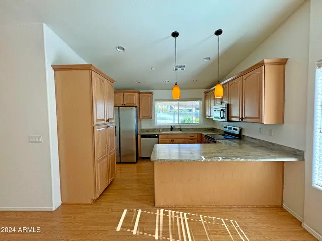 a view of a kitchen with a sink