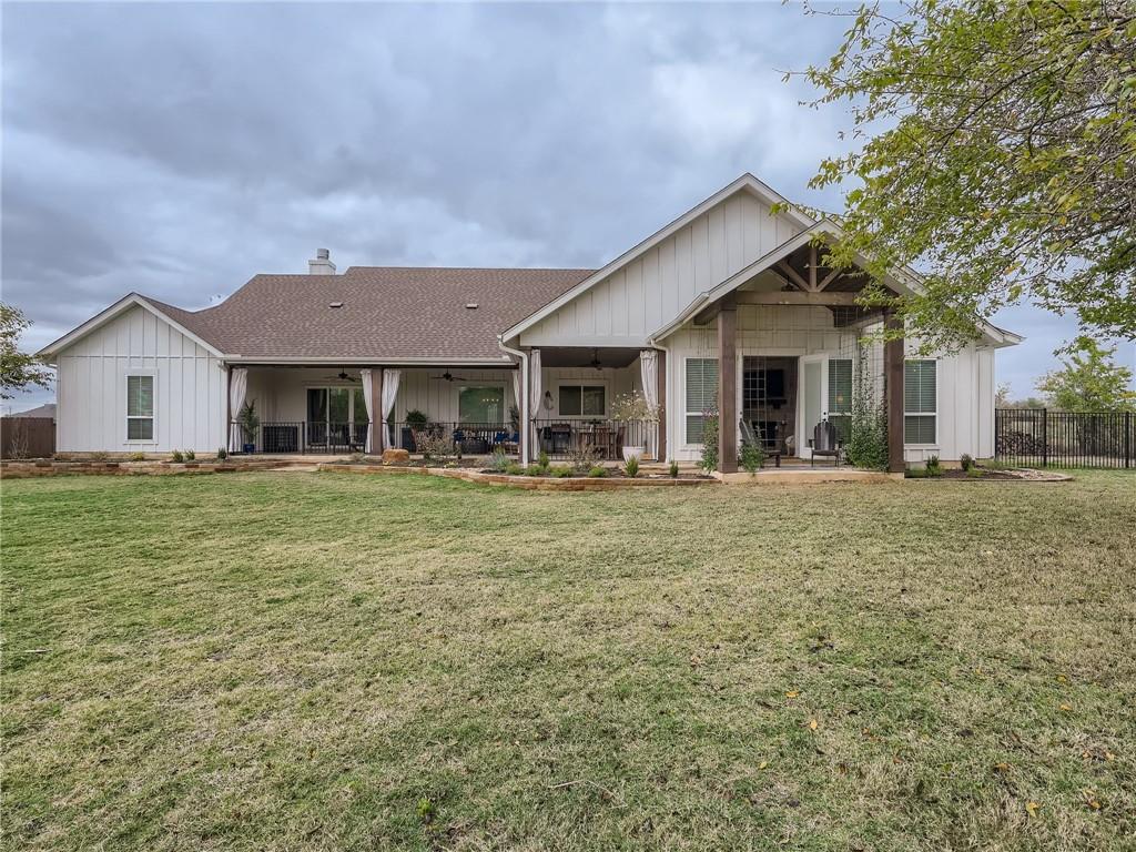 132 Huerta Road Florence, TX 76527 - Photo 30 of 40 A spacious backyard with an inviting covered patio provides ample outdoor living space.