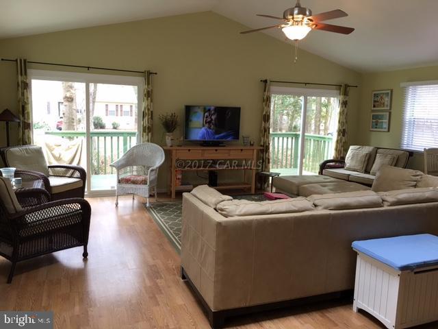 101 Pinehurst Road Ocean Pines, MD 21811 - Photo 6 of 14 a living room with furniture and a flat screen tv