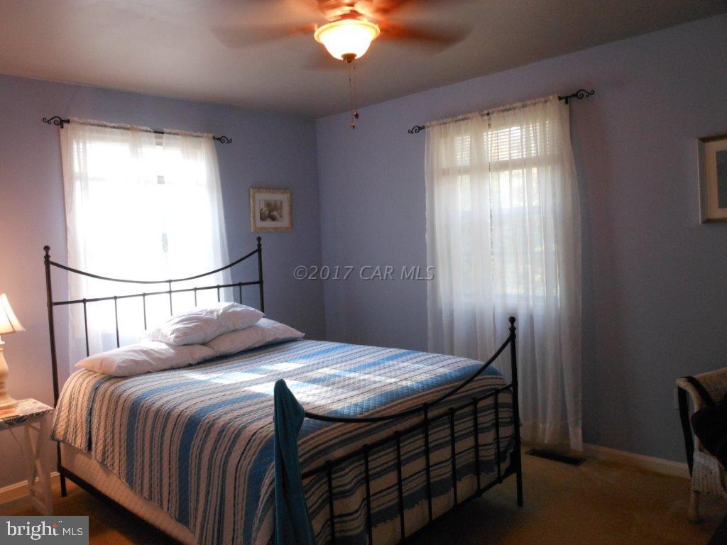 101 Pinehurst Road Ocean Pines, MD 21811 - Photo 8 of 14 a bedroom with a bed and a window
