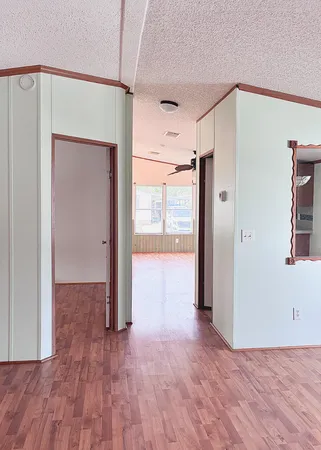 a bathroom with a bathtub sink and a mirror