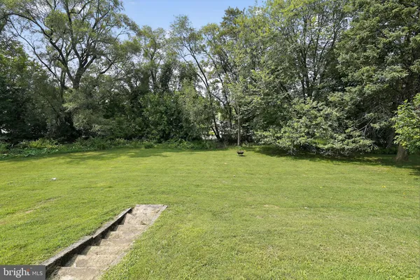 a view of a field with an trees