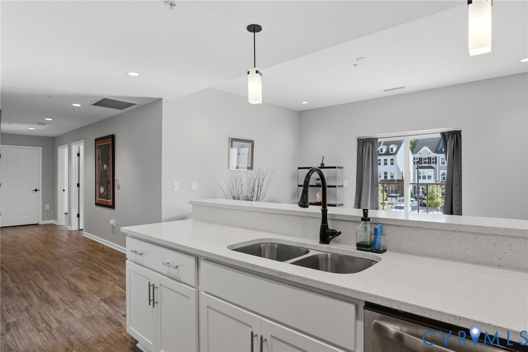 1504 Ewing Pk Loop, Unit 201 Midlothian, VA 23113 - Photo 11 of 18 a kitchen with a sink and a window