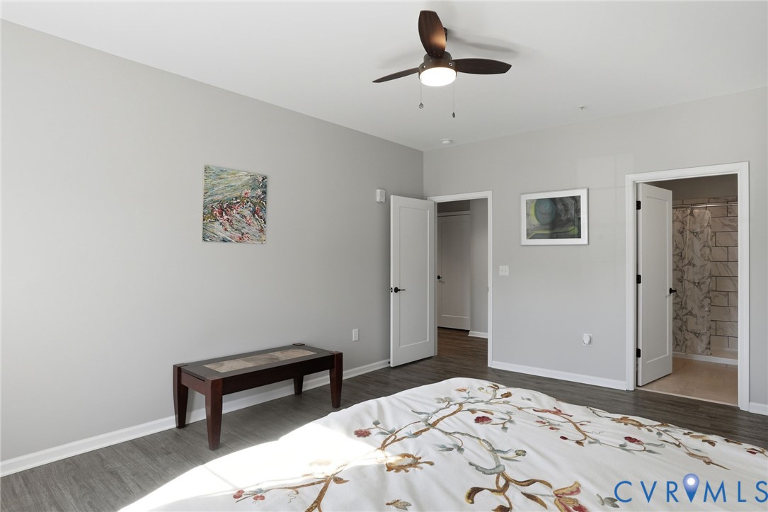 1504 Ewing Pk Loop, Unit 201 Midlothian, VA 23113 - Photo 13 of 18 a bedroom with a bed and a painting on the wall