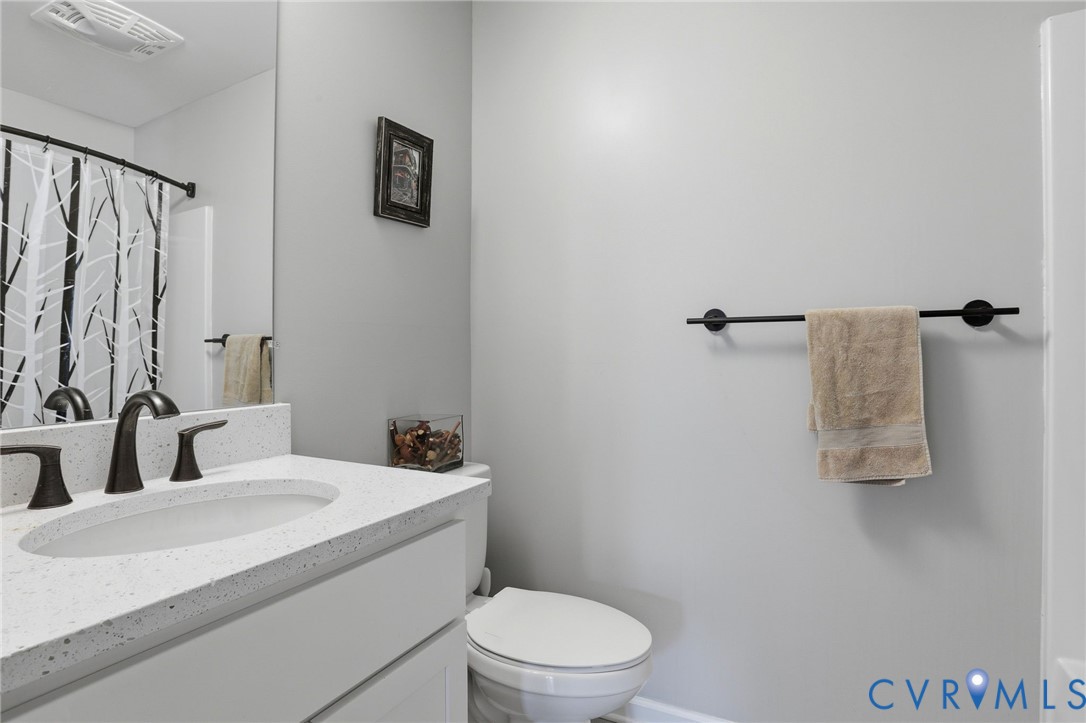 1504 Ewing Pk Loop, Unit 201 Midlothian, VA 23113 - Photo 16 of 18 a bathroom with a sink toilet and shower
