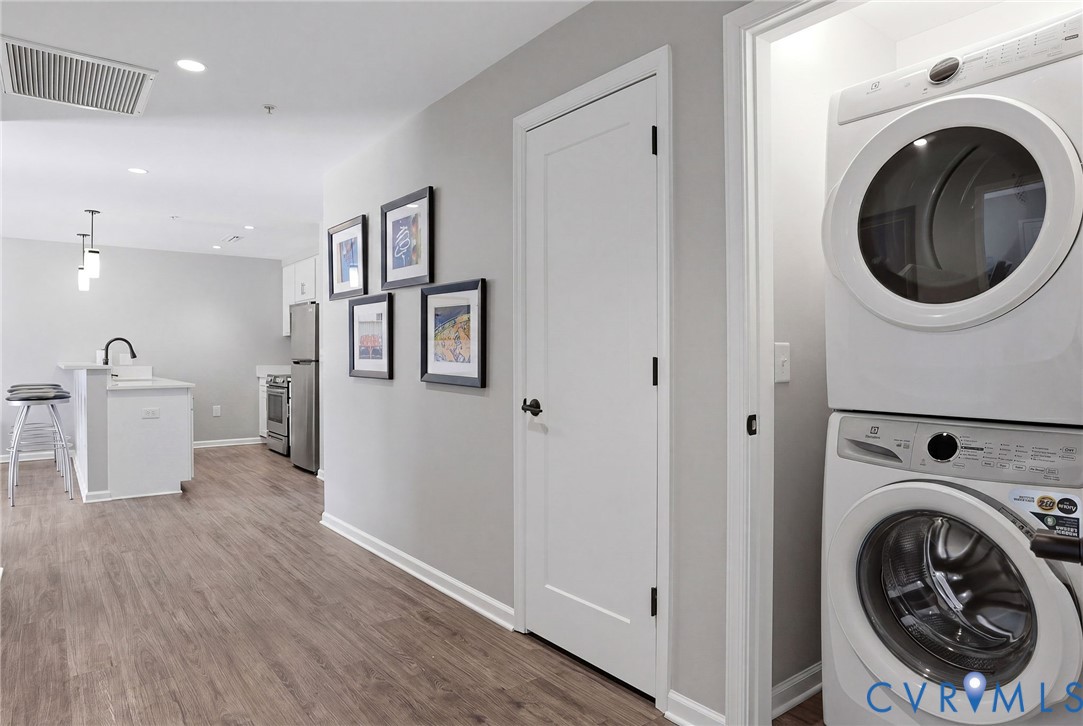 1504 Ewing Pk Loop, Unit 201 Midlothian, VA 23113 - Photo 17 of 18 a view of a hallway with washer and dryer