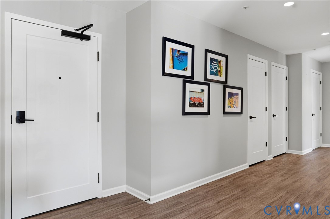 1504 Ewing Pk Loop, Unit 201 Midlothian, VA 23113 - Photo 3 of 18 a view of a hallway with wooden floor